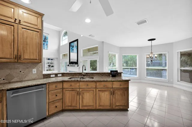 an aerial view of a house with a yard and garden