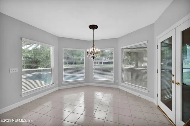 an aerial view of a house with a swimming pool yard and outdoor seating