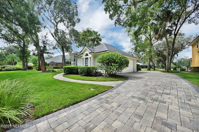 a living room with furniture fireplace and a table