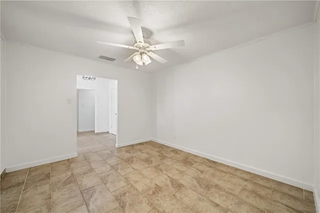 an empty room with a view of a house