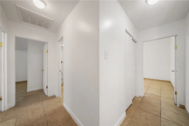 a view of a hallway with closet area