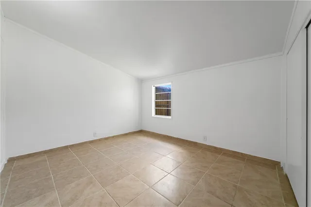 an empty room with a empty space and windows