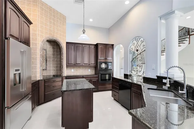 a bedroom with a bed and glass window