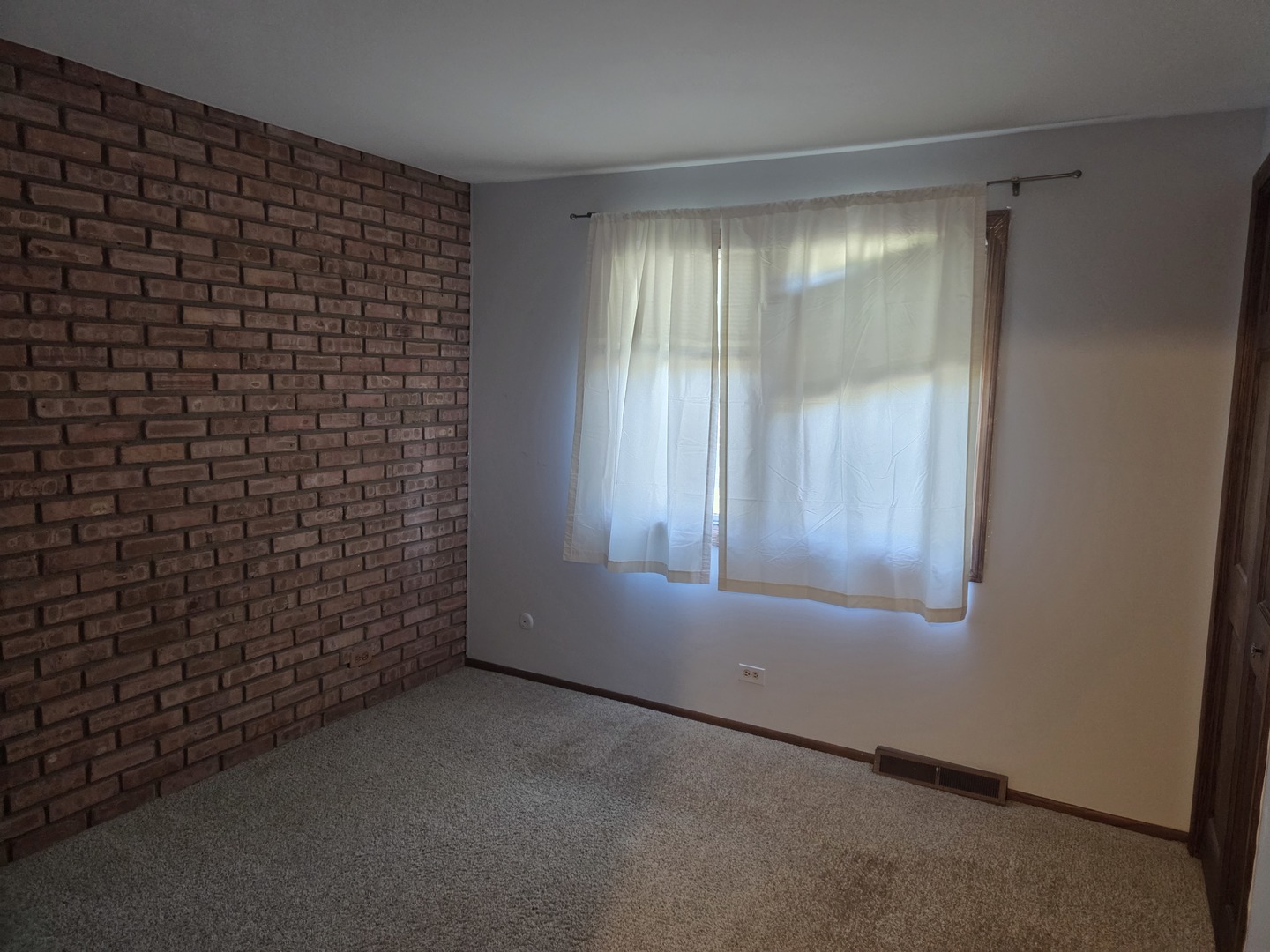 528 East Main Street Barrington, IL 60010 - Photo 12 of 18 a view of an empty room with a window