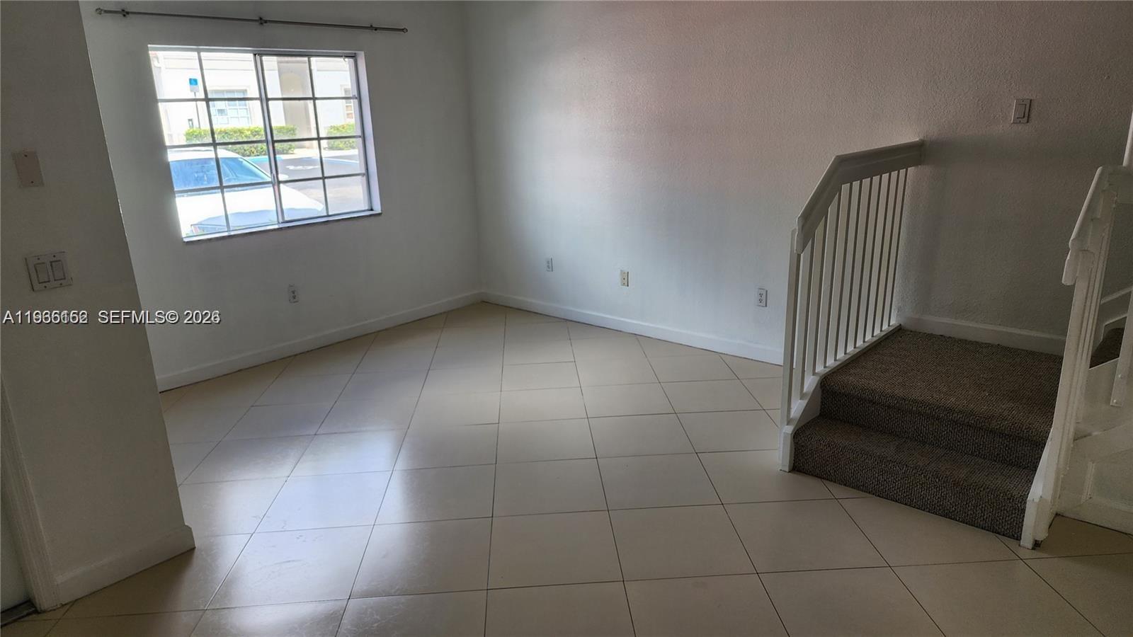 8450 Southwest 150th Avenue, Unit 3 Miami, FL 33193 - Photo 14 of 28 an empty room with windows
