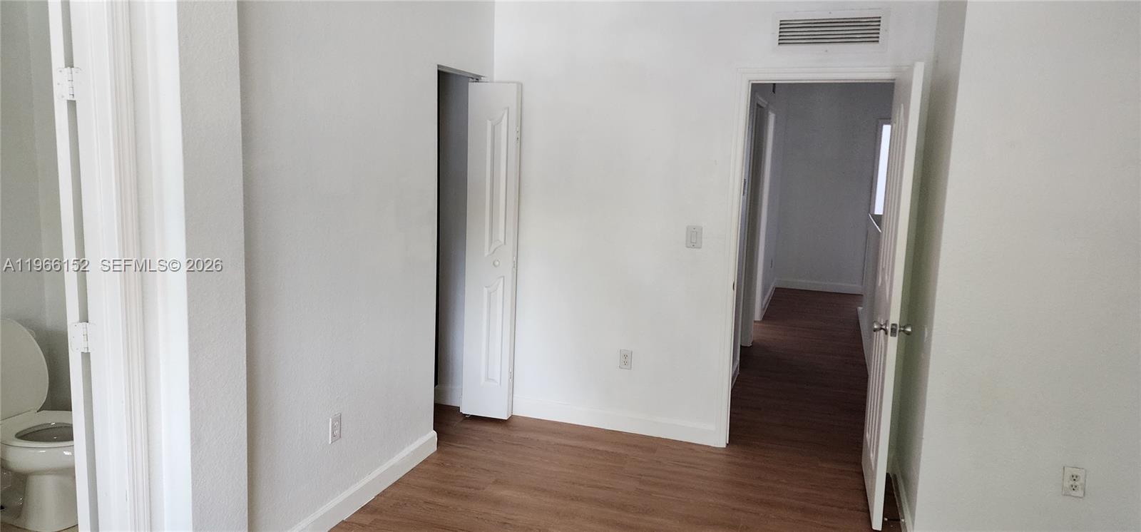 8450 Southwest 150th Avenue, Unit 3 Miami, FL 33193 - Photo 26 of 28 a view of a hallway with wooden floor