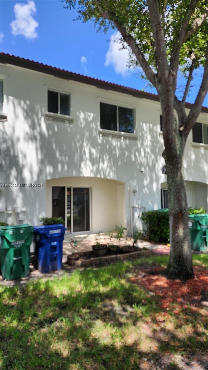 8450 Southwest 150th Avenue, Unit 3 Miami, FL 33193 - Photo 4 of 28 a front view of a house with garden