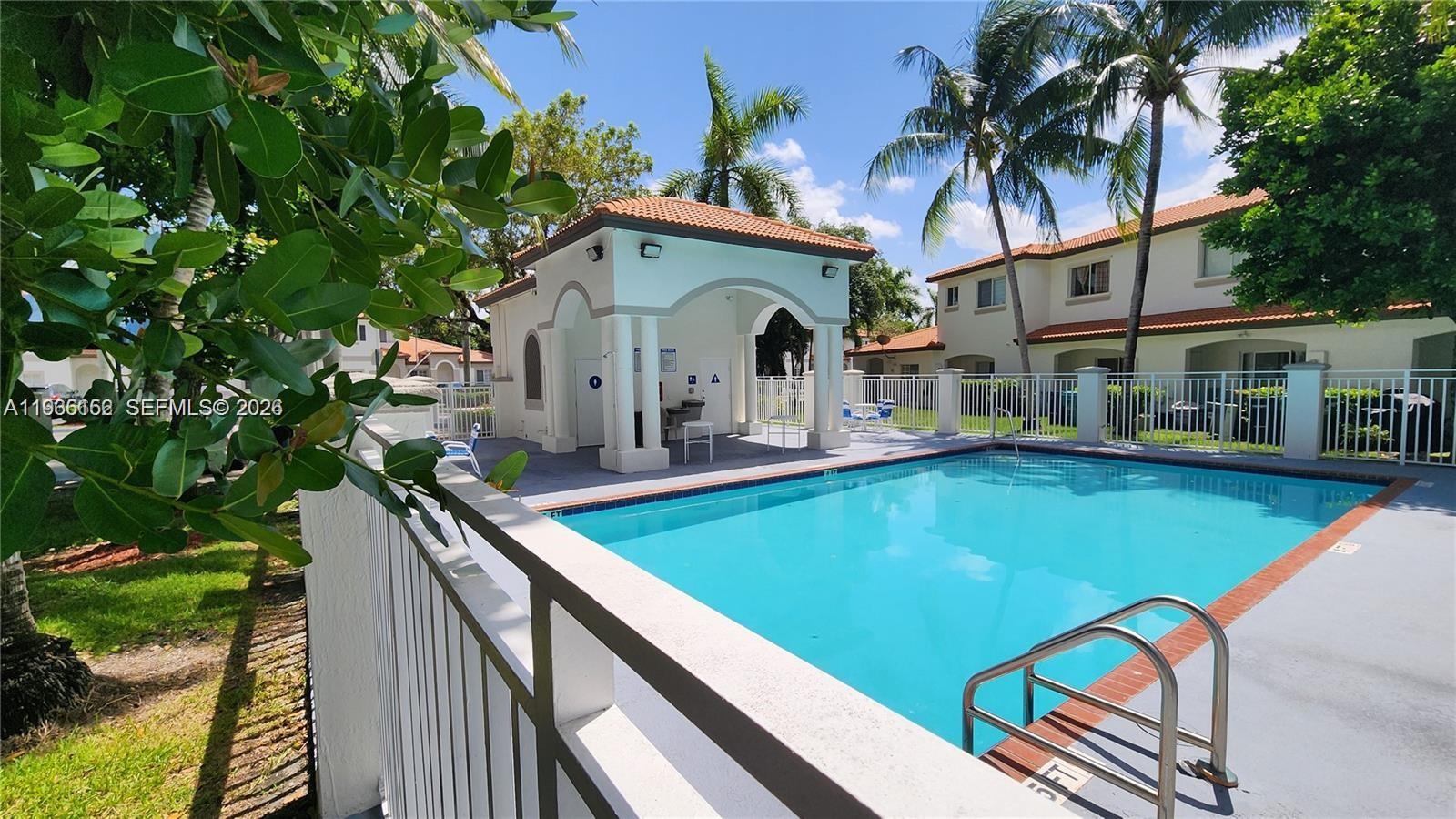 8450 Southwest 150th Avenue, Unit 3 Miami, FL 33193 - Photo 7 of 28 a view of swimming pool with a lounge chairs