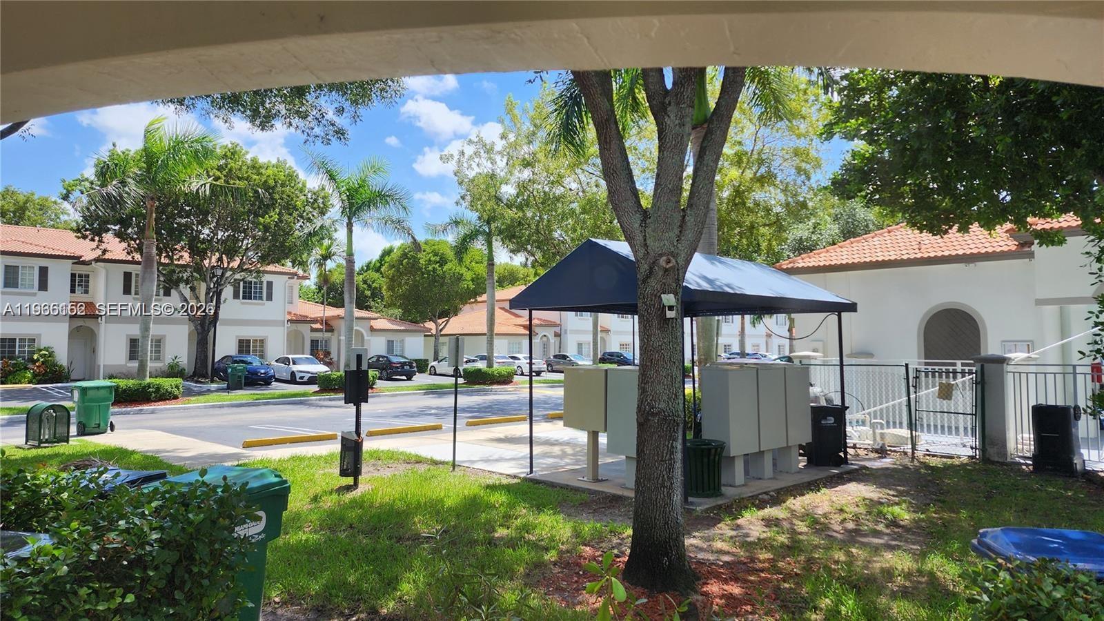 8450 Southwest 150th Avenue, Unit 3 Miami, FL 33193 - Photo 8 of 28 a view of a house with backyard porch and sitting area