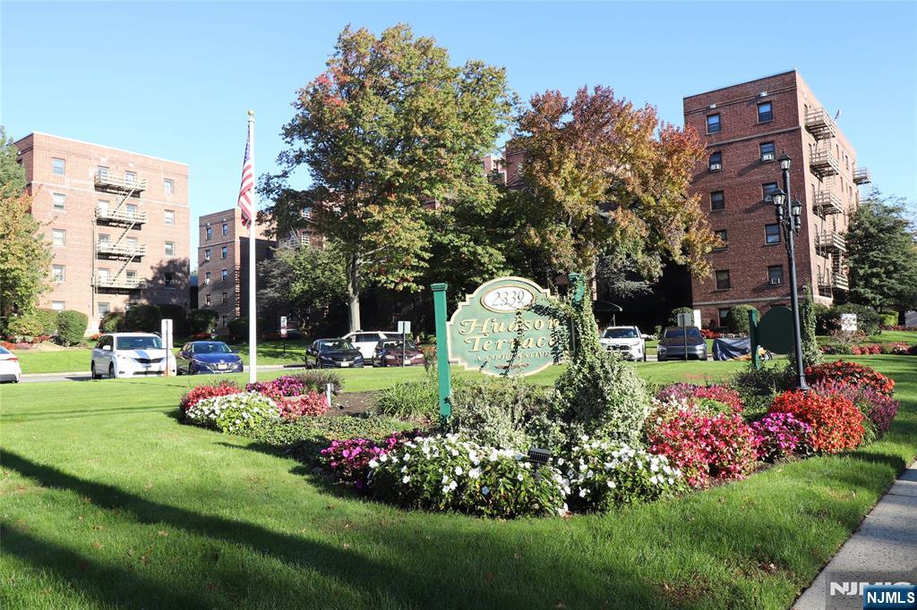 2335 Hudson Terrace, Unit E6 Fort Lee, NJ 07024 - Photo 1 of 29 a front view of a multi story building with community park
