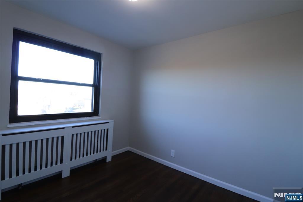 2335 Hudson Terrace, Unit E6 Fort Lee, NJ 07024 - Photo 18 of 29 a view of a hallway with a window