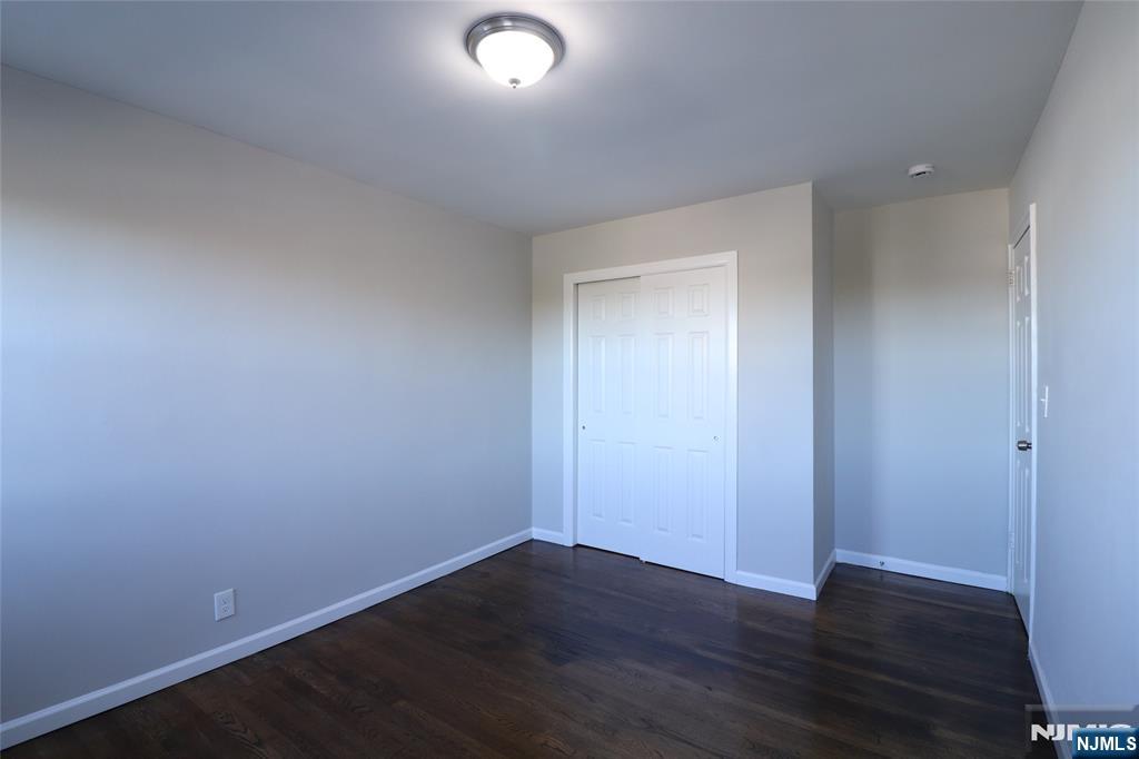 2335 Hudson Terrace, Unit E6 Fort Lee, NJ 07024 - Photo 19 of 29 a view of an empty room with wooden floor