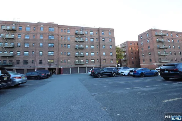a view of cars parked in front of a building