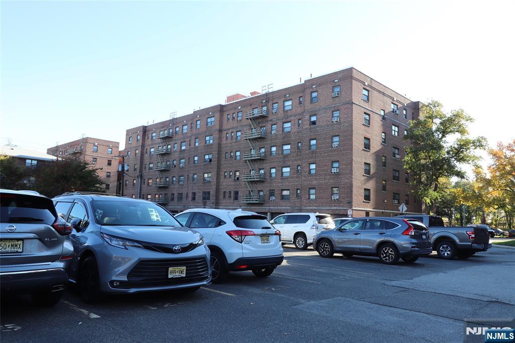 2335 Hudson Terrace, Unit E6 Fort Lee, NJ 07024 - Photo 28 of 29 a car parked in front of a building