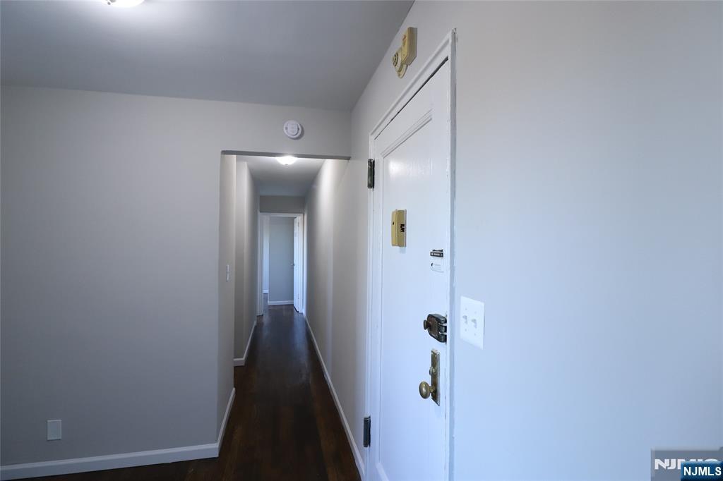 2335 Hudson Terrace, Unit E6 Fort Lee, NJ 07024 - Photo 3 of 29 a view of a hallway with wooden floor and closet
