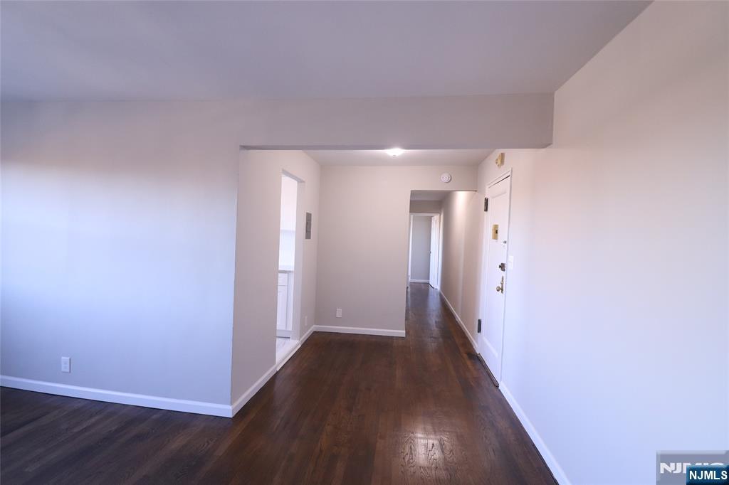 2335 Hudson Terrace, Unit E6 Fort Lee, NJ 07024 - Photo 4 of 29 a view of a hallway with wooden floor