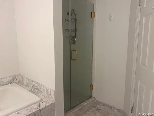 a bathroom with a sink and mirror with toilet