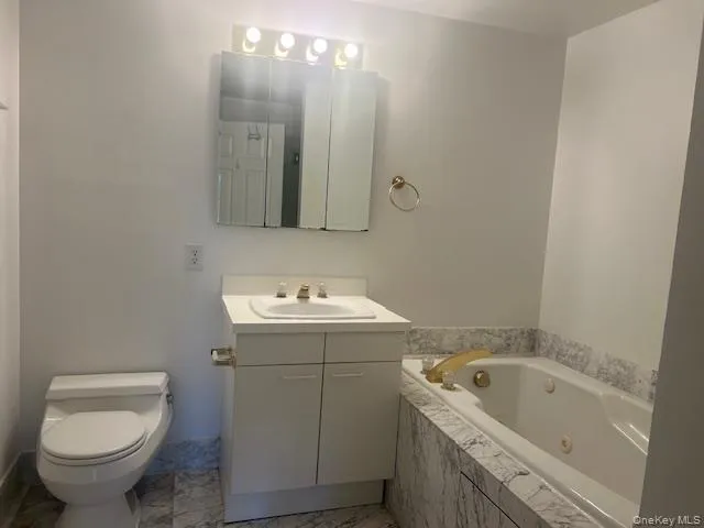 an empty room with wooden floor and closet