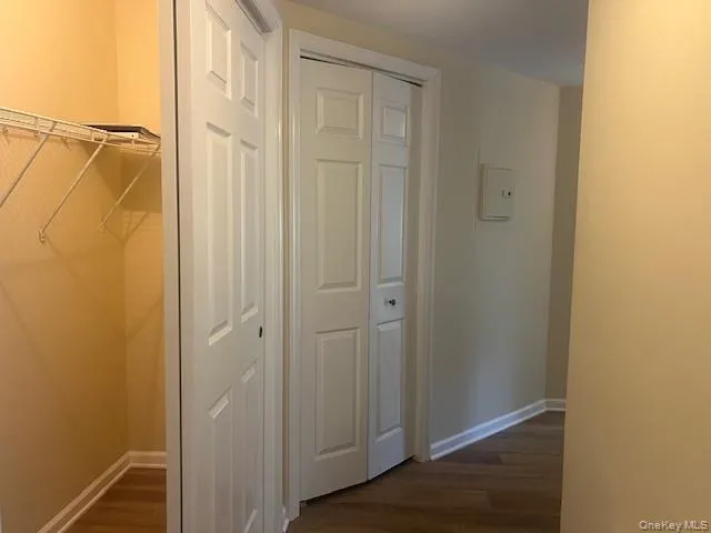 a view of a wooden balcony with a tree