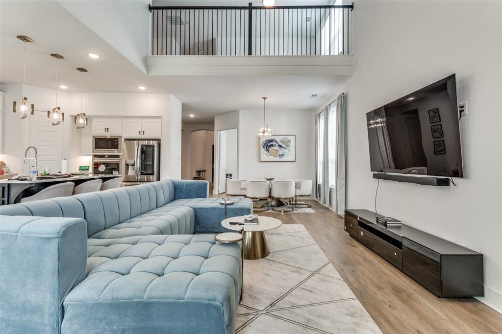503 North Eagle Pt Road Van Alstyne, TX 75495 - Photo 3 of 25 Living room with recessed lighting, a chandelier, a high ceiling, and light wood finished floors
