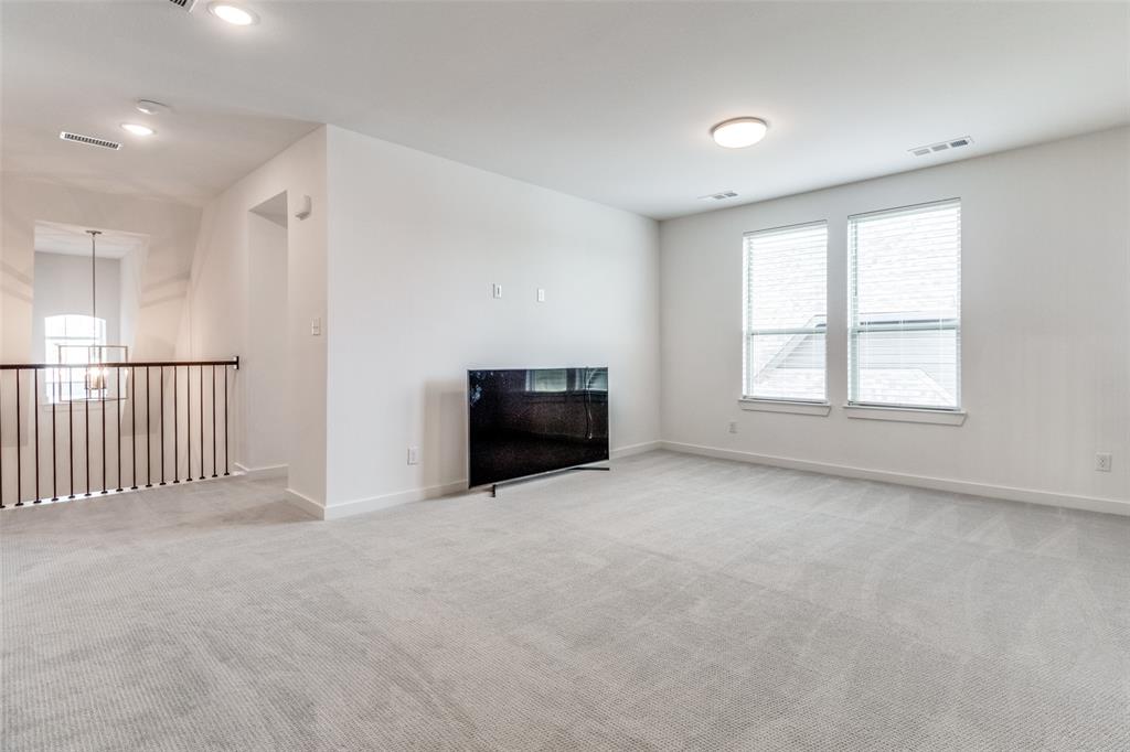 503 North Eagle Pt Road Van Alstyne, TX 75495 - Photo 7 of 25 Unfurnished living room featuring light colored carpet, healthy amount of natural light, and recessed lighting