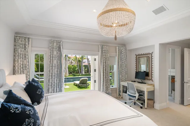 a bathroom with a granite countertop sink a mirror and a bathtub