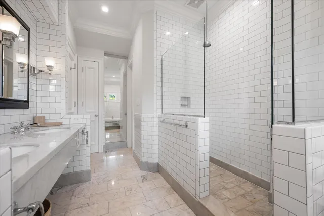 a spacious bedroom with a bed and glass door