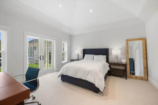 a bedroom with a bed and a desk