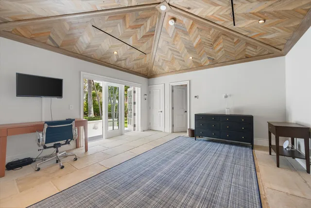 a bathroom with a sink a toilet a mirror and shower