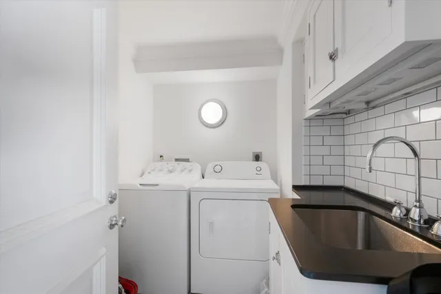 a bathroom with a shower and a sink