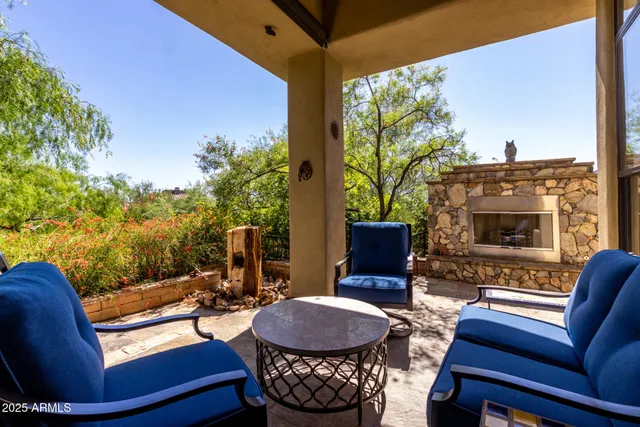 a outdoor living space with furniture potted plant and a lamp