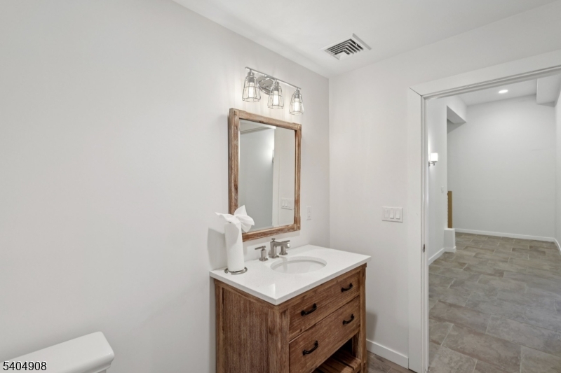 20 Mt Pleasant Road Morristown, NJ 07960 - Photo 35 of 48 a bathroom with a sink a toilet and mirror
