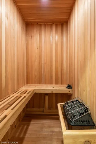 a view of a sink and dishwasher with wooden floor