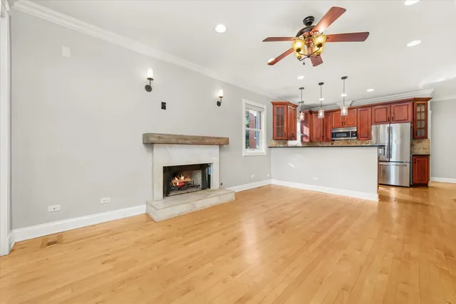 a view of a kitchen with a sink and a fireplace