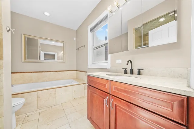 a bathroom with a sink a bathtub and a shower