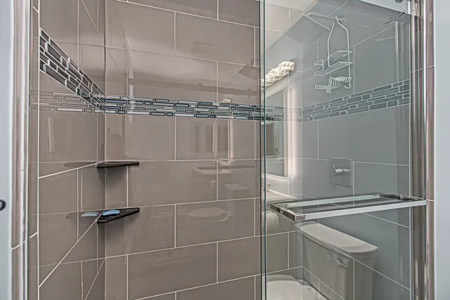 a bedroom with a bed and a desk