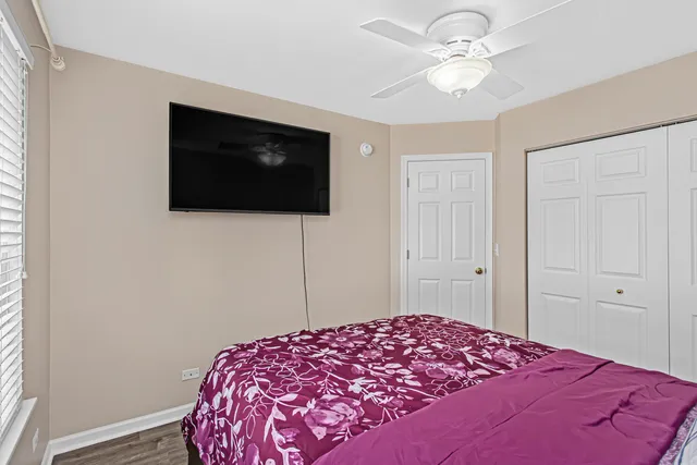 a bathroom with a sink vanity mirror and toilet