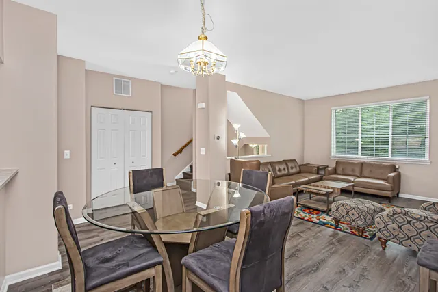 a view of a dining room with furniture window and outside view