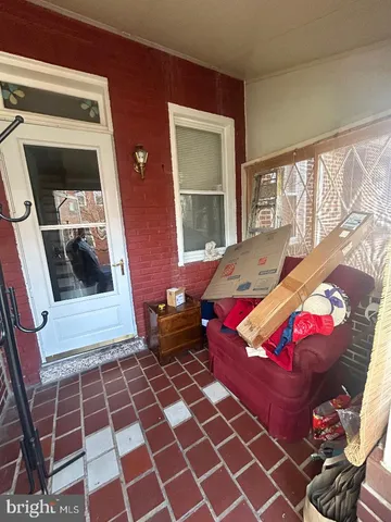 a bedroom with furniture and a rug