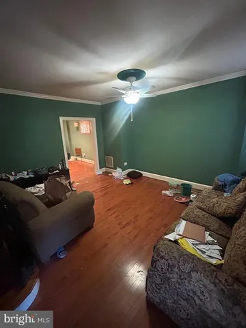 a bedroom with a bed and ceiling fan