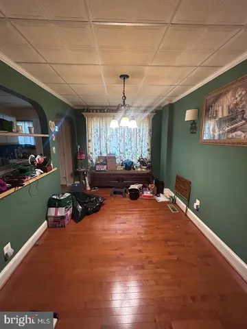 a bedroom with furniture and a mirror