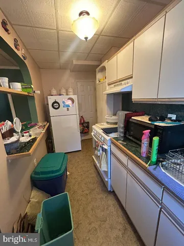 a view of a backyard with sitting area