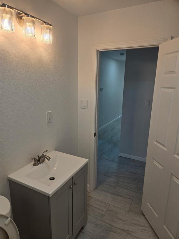 2110 North 6th Street Waco, TX 76708 - Photo 19 of 23 a bathroom with a sink toilet and shower