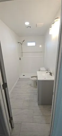 a view of hallway with wooden floor