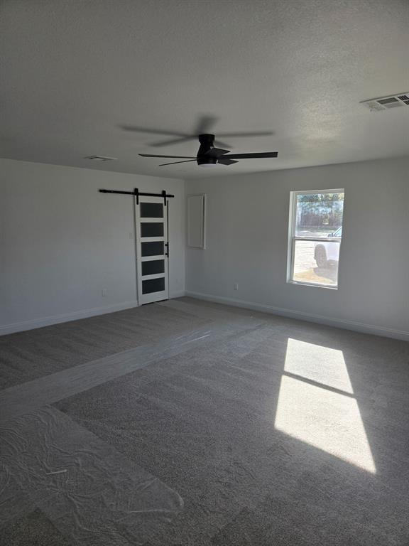 2110 North 6th Street Waco, TX 76708 - Photo 7 of 23 an empty room with windows and fan