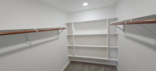 a view of an empty walk in closet