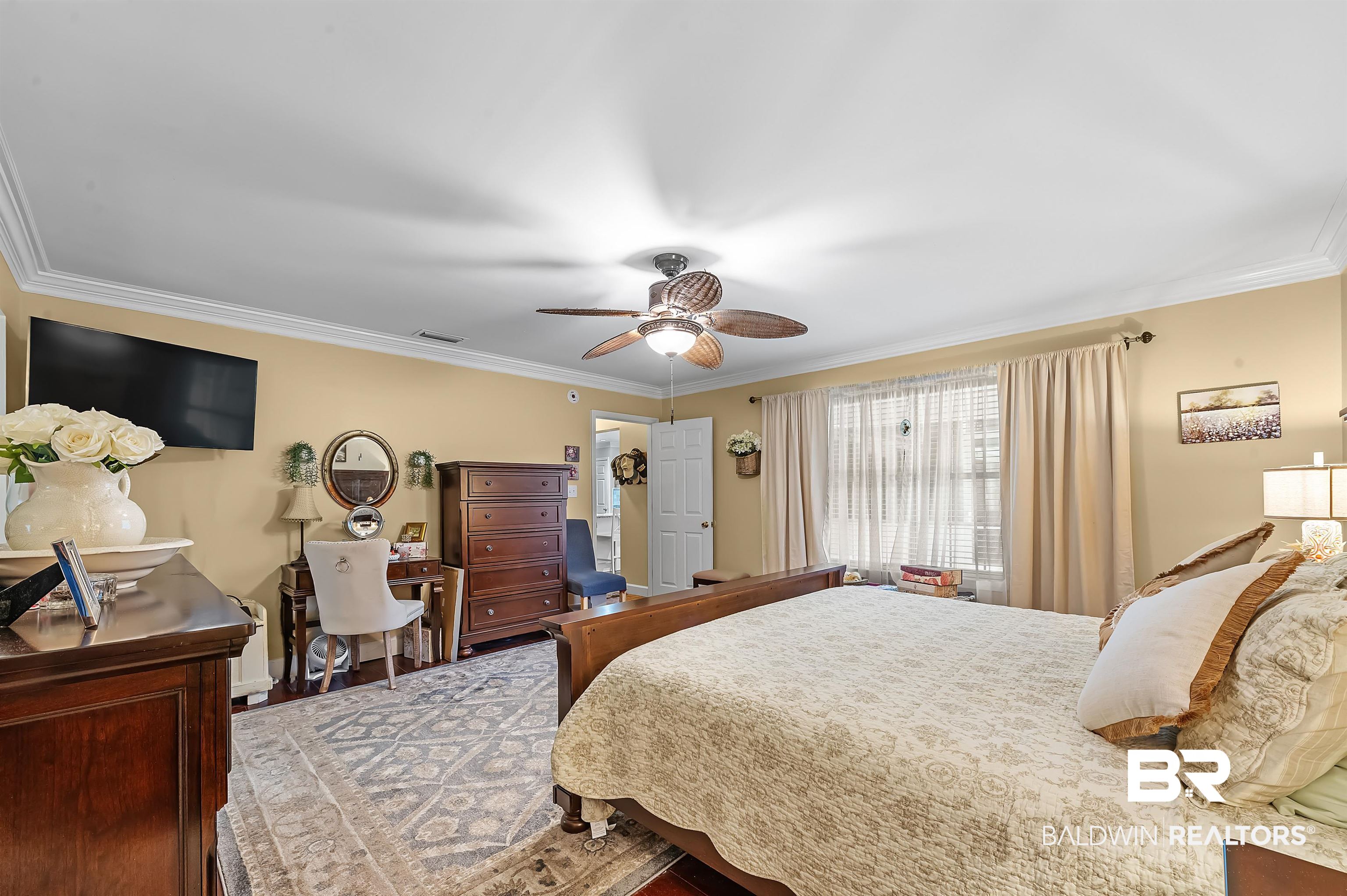 9901 Glover Court Fairhope, AL 36532 - Photo 19 of 52 Bedroom featuring ceiling fan, light hardwood / wood-style flooring, and ornamental molding