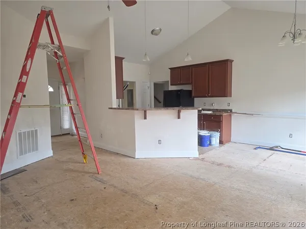 a kitchen with stainless steel appliances a sink stove and microwave