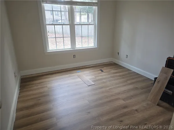 a room with lots of furniture and a chandelier