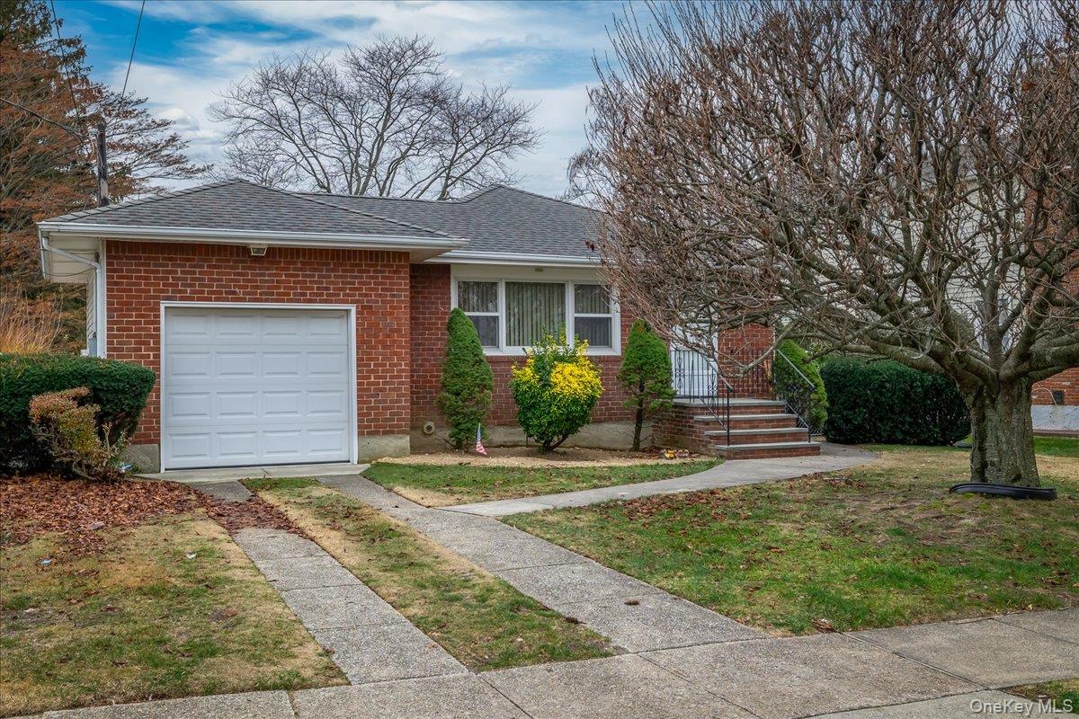 41 Meade Avenue Bethpage, NY 11714 - Photo 1 of 1 a front view of a house with a yard